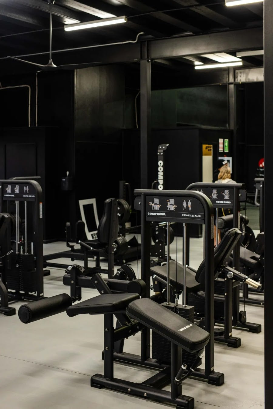 Pin-loaded machine floor in a 24/7 gym fitout by Compound Fitness