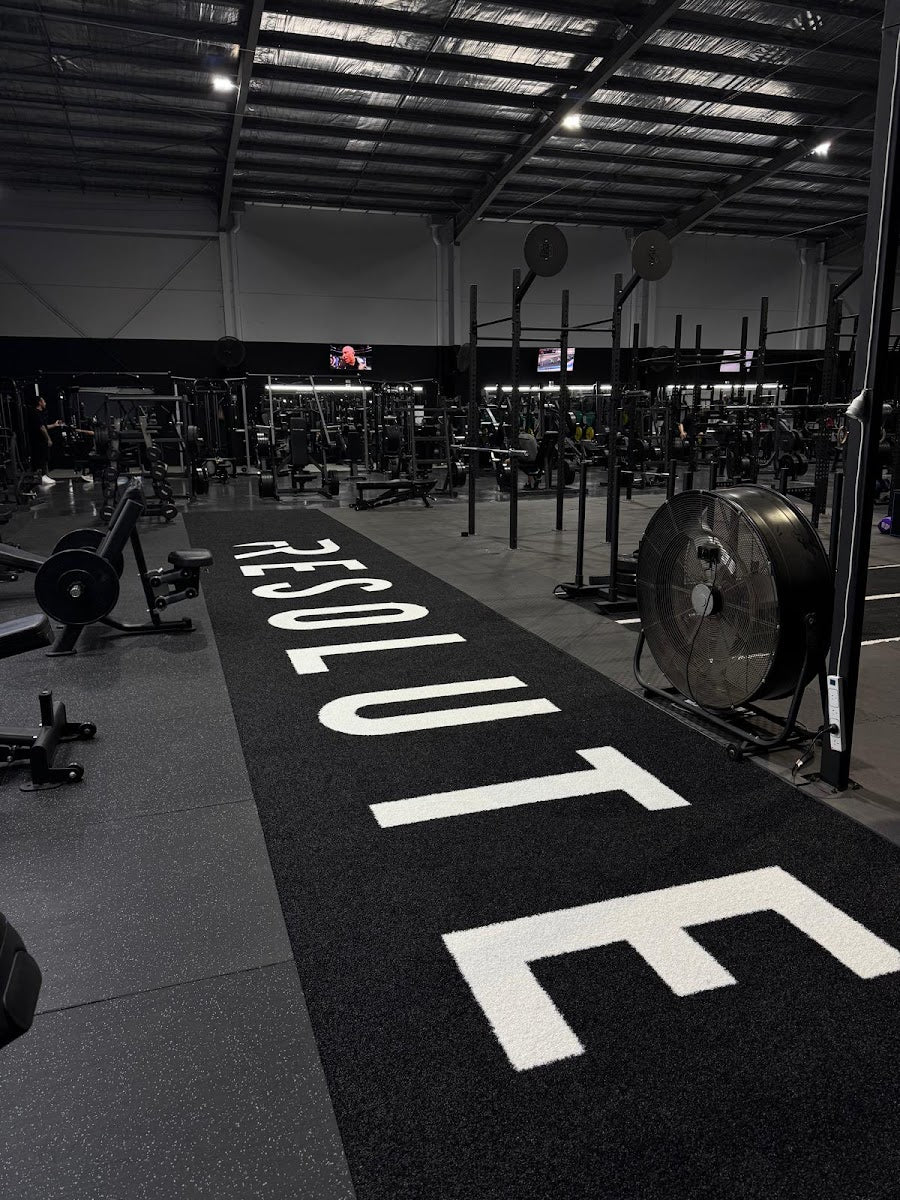 Turf runway through a full warehouse 24/7 gym fitout by Compound Fitness