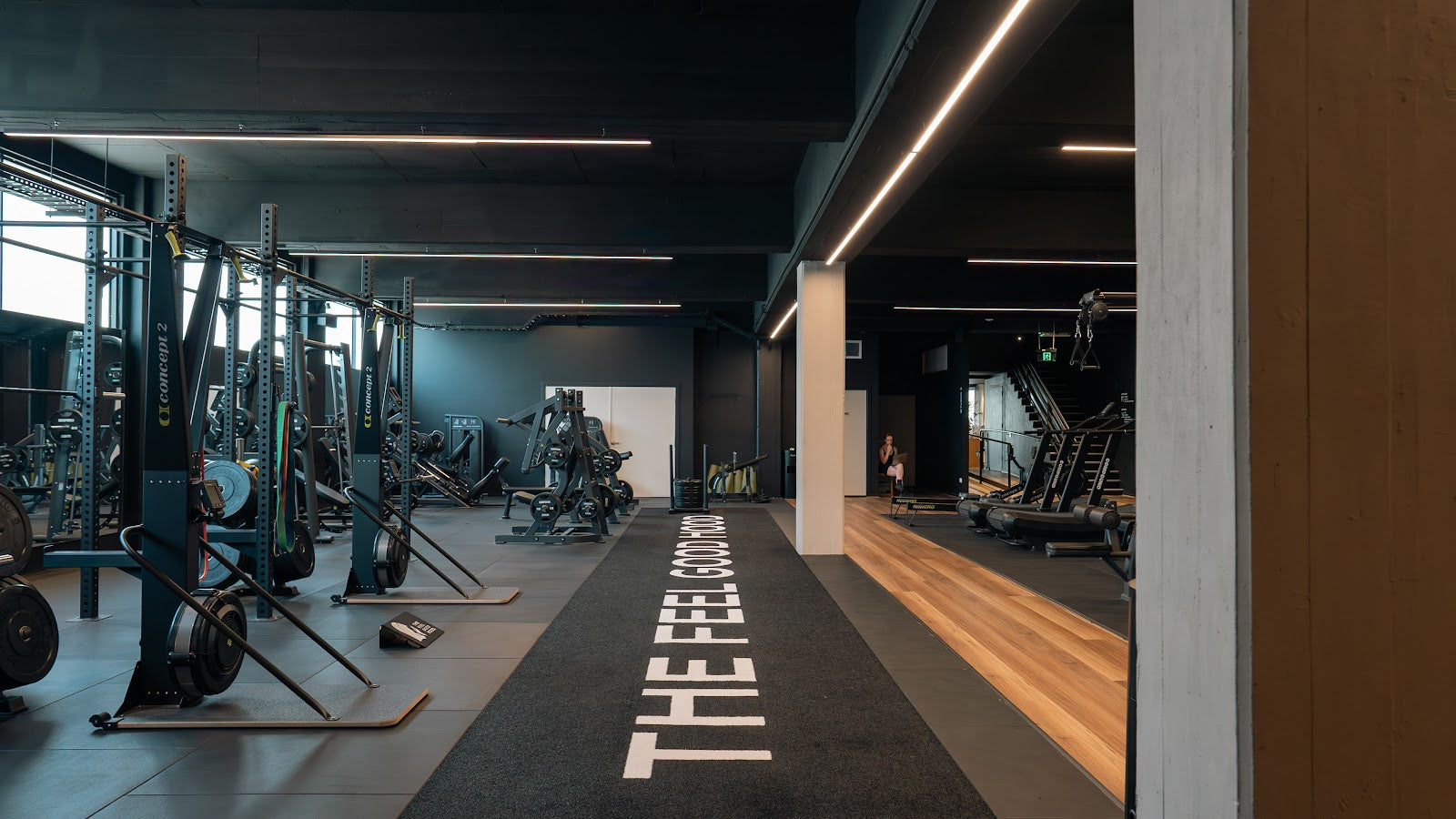 24/7 gym fitout with custom branded turf runway and full equipment floor by Compound Fitness